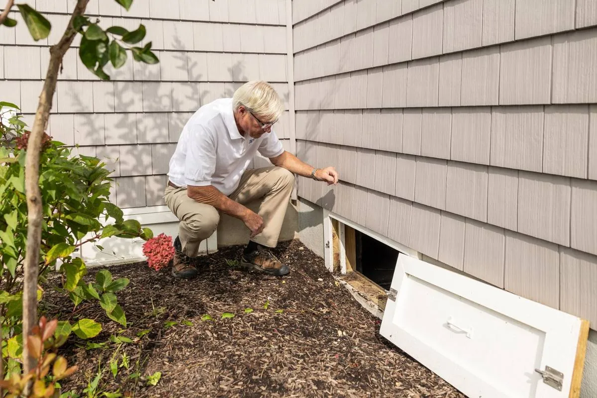 Inspector checking the outside of a home during a septic and property inspection in Bucks County, PA