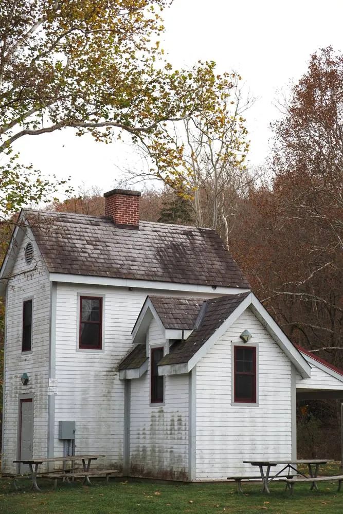 White wooden house among autumn trees in Solebury Township near New Hope, PA, where most homes use septic systems